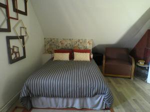 Postel nebo postele na pokoji v ubytování LE CLOCOONING Chambres d'Hôtes chez l'habitant