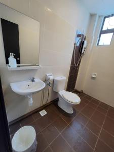 a bathroom with a toilet and a sink at Malacca City Center Town House by 360HOME in Melaka