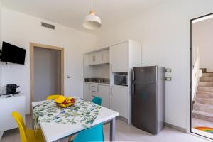 A kitchen or kitchenette at Le scuderie 1