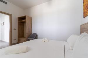 A bed or beds in a room at Le scuderie 1