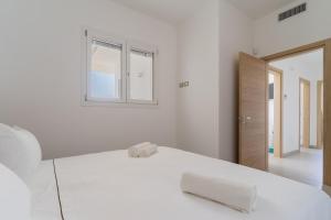 A bed or beds in a room at Le scuderie 1