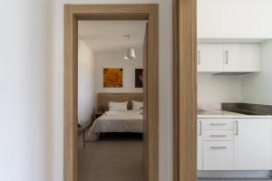 A bed or beds in a room at Le scuderie 1