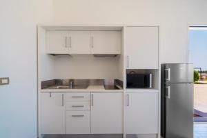 A kitchen or kitchenette at Le scuderie 1