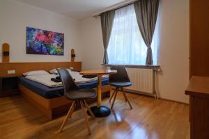 Posteľ alebo postele v izbe v ubytovaní Flataid Gästehaus Graschi - Steinbergstraße