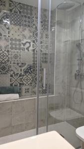 a bathroom with a shower with a glass door at CABALLITO DE MAR in Los Alcázares