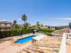 a villa with a swimming pool and a resort at Cubo's Villa Dovecote Las Delicias in Coín