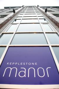 a sign on the side of a maroc building at Kepplestone Manor in Aberdeen