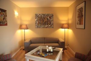 Гостиная зона в Le Patio Père Pigne Guestroom