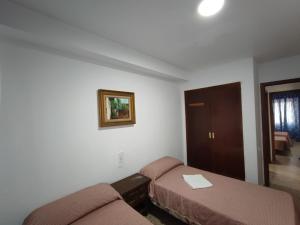 Postel nebo postele na pokoji v ubytování Edificio Entremares