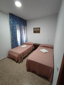 Postel nebo postele na pokoji v ubytování Edificio Entremares