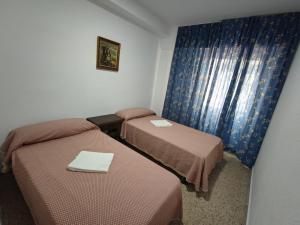 Postel nebo postele na pokoji v ubytování Edificio Entremares