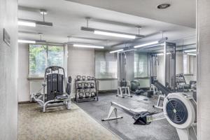 a room with a gym with a fan and weights at UWS 1br w doorman gym nr Central Park NYC-932 in New York
