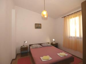 Postel nebo postele na pokoji v ubytování Apartmani Korljan