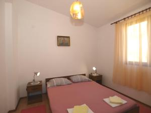 Postel nebo postele na pokoji v ubytování Apartmani Korljan
