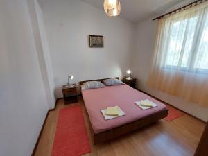 Postel nebo postele na pokoji v ubytování Apartmani Korljan
