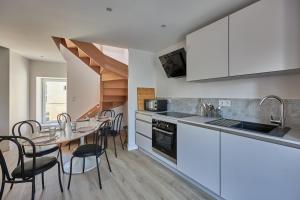 Kuchyň nebo kuchyňský kout v ubytování Maison Andrias - Charmante maison de bourg