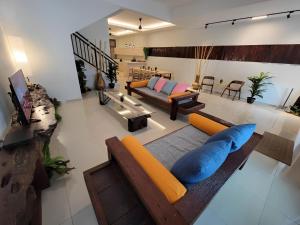 a large living room with a couch and a table at Malacca City Center Town House by 360HOME in Melaka