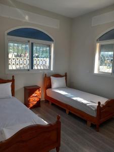 מיטה או מיטות בחדר ב-Flat cosy La CAMELIA Inn Tanger