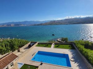 an aerial view of a large body of water at Pool and Beachfront Apartment Ena - Perfect Family Escape in Pag