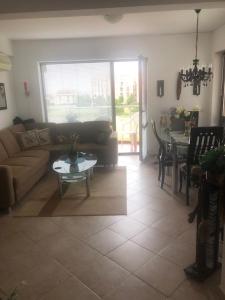 a living room with a couch and a table at Ravda Sun Sea Ressort 2 in Ravda