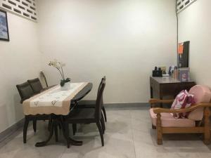 a dining room with a table and chairs at Carols Guesthouse near Jonker and Satay Celup in Melaka