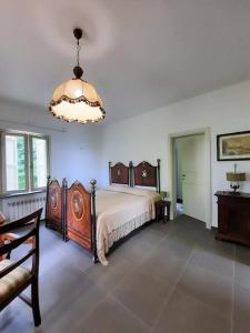 Кровать или кровати в номере Cottage Fonte al Pruno