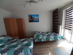 Posteľ alebo postele v izbe v ubytovaní Apartament na Podwalu