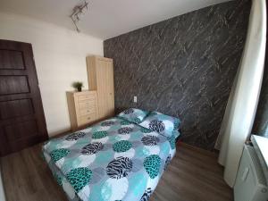 Posteľ alebo postele v izbe v ubytovaní Apartament na Podwalu