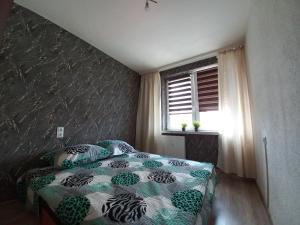Posteľ alebo postele v izbe v ubytovaní Apartament na Podwalu