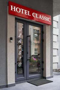 a hotel closure sign over the door of a building at Hotel Classic in Kyiv