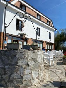 a building with tables and chairs in front of it at El Pradón in Mar