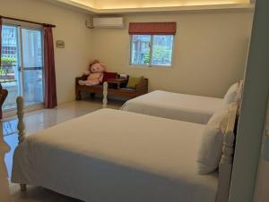Postel nebo postele na pokoji v ubytování Taroko Bay B&B