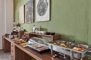 a buffet line with many different types of food at Charm Hotel, Hersonissos in Hersonissos