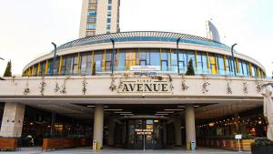 a large building with a sign that reads avenue at Avenue guest غرف فندقية in Buyukcekmece