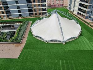 an overhead view of a large white tent on a green field at Avenue guest غرف فندقية in Buyukcekmece