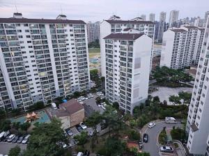 an aerial view of a city with tall buildings at Dongtan Sharp-2 Family House in Hwaseong