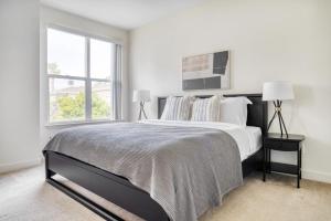a white bedroom with a large bed and a window at Sunnyvale 1BR w Pool WD Gym nr 101 SFO-1050 in Sunnyvale +24 photos