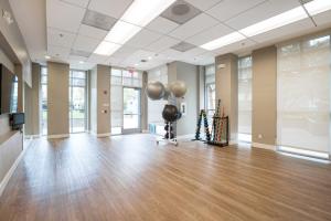a large room with wooden floors and windows at Sunnyvale 1BR w Pool WD Gym nr 101 SFO-1050 in Sunnyvale
