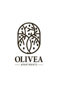 an old tree in a circle logo at Olivea Apartments in Velipojë