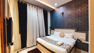 Voodi või voodid majutusasutuse Hotel Rajyashree Palace toas