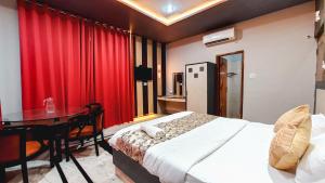 Voodi või voodid majutusasutuse Hotel Rajyashree Palace toas
