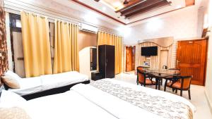 Voodi või voodid majutusasutuse Hotel Rajyashree Palace toas