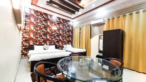 Voodi või voodid majutusasutuse Hotel Rajyashree Palace toas