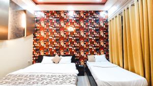 Voodi või voodid majutusasutuse Hotel Rajyashree Palace toas