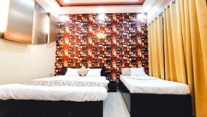 Voodi või voodid majutusasutuse Hotel Rajyashree Palace toas