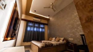 Voodi või voodid majutusasutuse Hotel Rajyashree Palace toas
