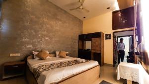 Voodi või voodid majutusasutuse Hotel Rajyashree Palace toas