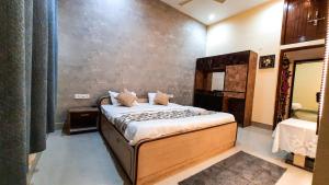 Voodi või voodid majutusasutuse Hotel Rajyashree Palace toas