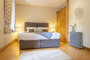 a bedroom with a large bed in a room at Askrigg Chapel in Askrigg