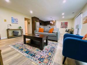 a living room with a couch and a coffee table at 2 BR Family Friendly Nature Getaway near Golf Course in Kalamazoo
